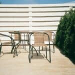 black metal framed white wooden table and chairs
