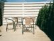black metal framed white wooden table and chairs
